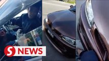 Cops tracking car driver who rammed, threatened motorcyclist