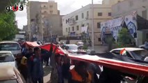 مسيرة بأطول علم في قنا لحث المواطنين على المشاركة في الانتخابات