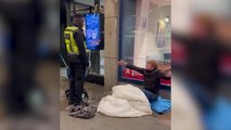 Anger as security guard mops floor where homeless man is sitting