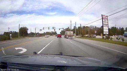 Moment hijacked car smashes into police vehicle head-on