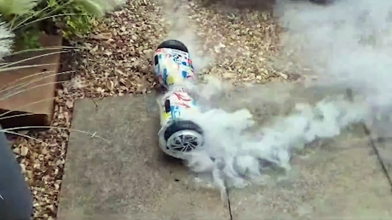 Hoverboard catches fire while being charged - and explodes - video ...