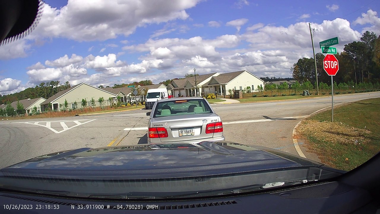 Turning Car Collides With Postal Van