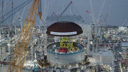 Drone footage of Hinkley C's first reactor building dome being lifted into place.