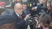 Angry Rudy Giuliani leaves court after being ordered to pay $148 million to election workers he defamed