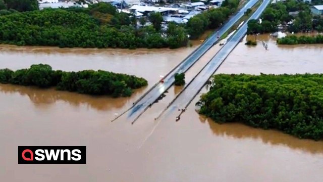 Major flooding leaves Australian highway completely submerged - and infested with CROCS