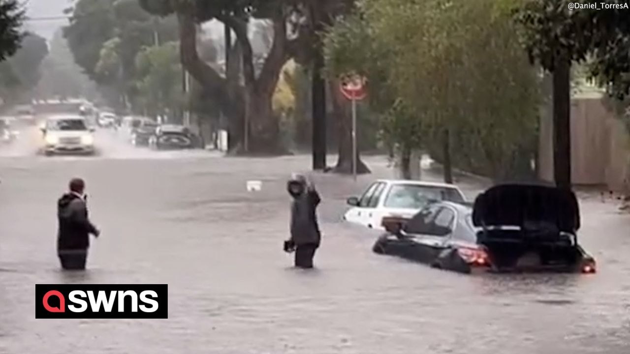 Video shows cars submerged and residents wading through floodwater in Santa Barbara