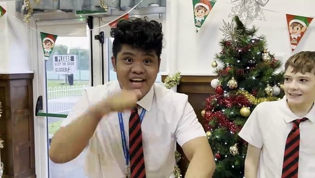 Vhon, Ajay and Veronica from Doncaster Deaf Trust sign ‘Merry Christmas, Happy New Year, 2024’