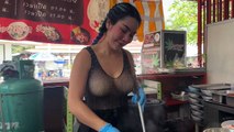 Lady chef cooking the most popular pork noodles - Thai street food