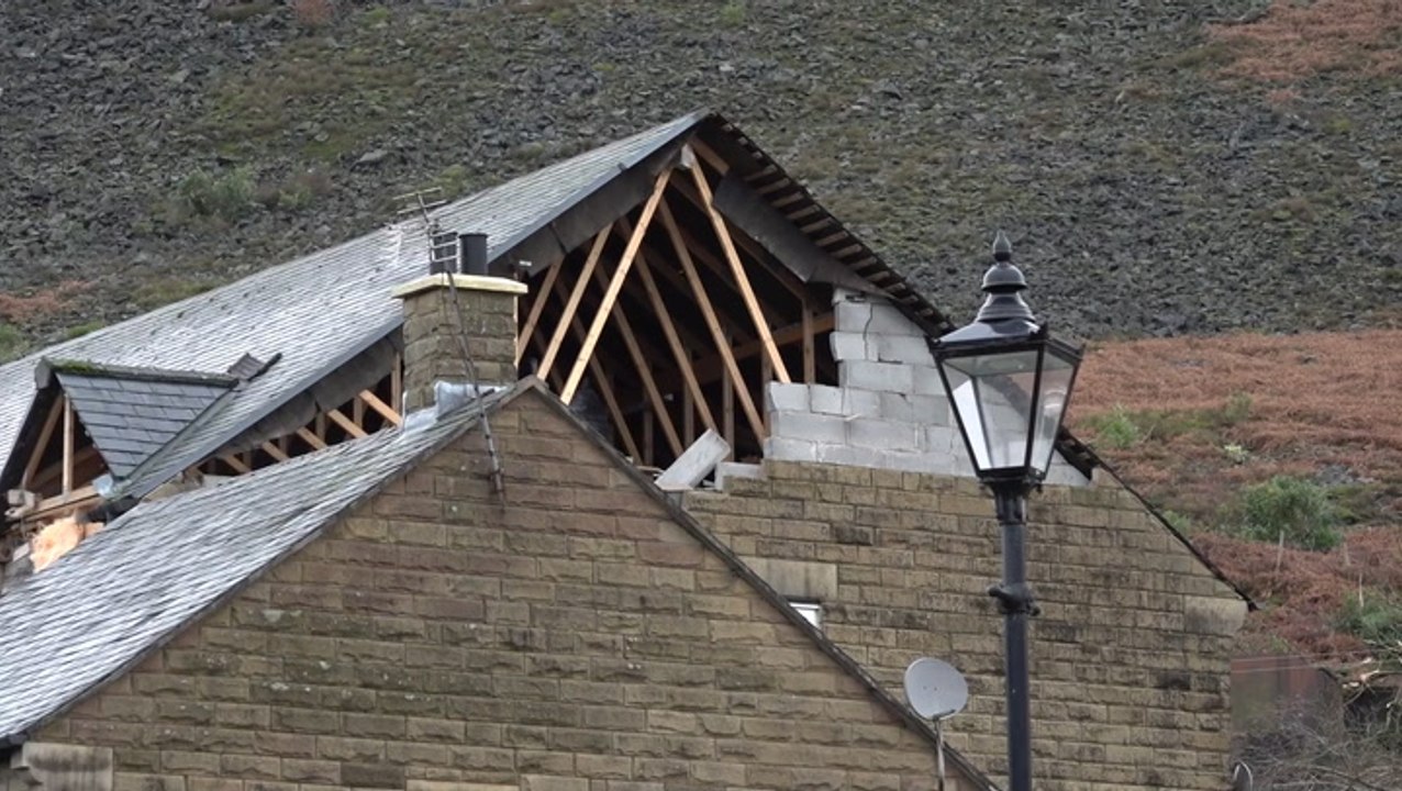 Houses damaged and debris scattered across roads after ‘tornado’ rips through Manchester suburb