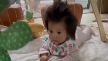 Baby has hair so thick people think it's a WIG!