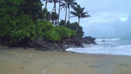 Rain on Island's Beach : Coastal Beauty with Dark Clouds, Gloomy Waves, and Island Serenity