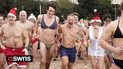 Hardy souls take the dip for their Christmas swim