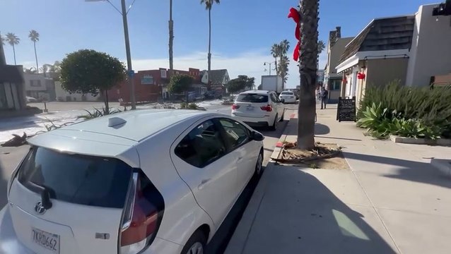 Massive waves crash onto roads as California beachgoers flee shore