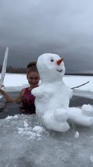 Destroying a Snow man in Russia in frozen lake with ice sword
