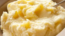 The Creamy Ingredient You Should Be Adding To Mashed Potatoes (& Other Tips)