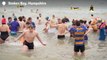 Watch: Hundreds brave icy waters for New Year’s Day dip