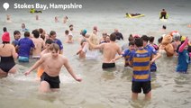 Watch: Hundreds brave icy waters for New Year’s Day dip