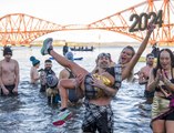 Dozens of swimmers have taken a New Year's Day dip into the Firth of Forth in the annual Loony Dook.
