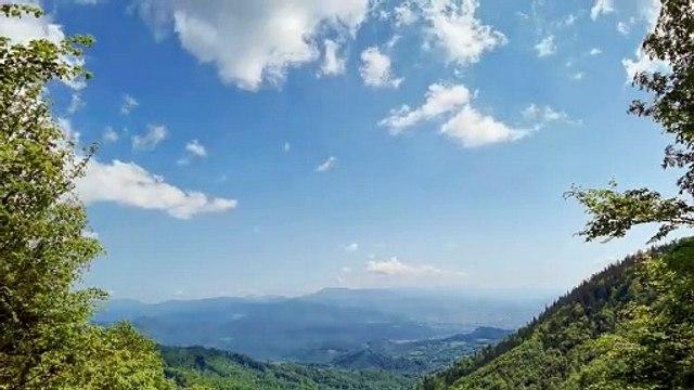 Beautiful clouds over a green landscape time lapse - Relax in Nature with