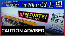 Japan lowers tsunami alert but maintains coast evacuation