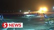 Horrific moment Japan passenger plane catches fire after landing on Tokyo runway