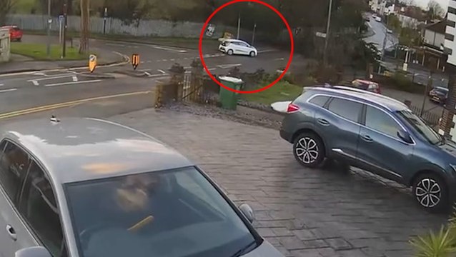 Car narrowly misses being hit by falling tree as UK battered by Storm Henk