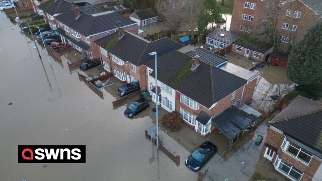 Families trapped in flooded homes after canal bursts its banks during Storm Henk