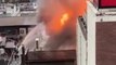 Firefighters battle rising flames after blaze breaks out near railway station in Japan