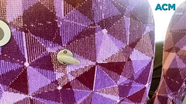 V/Line passenger sits underneath a torrent of water