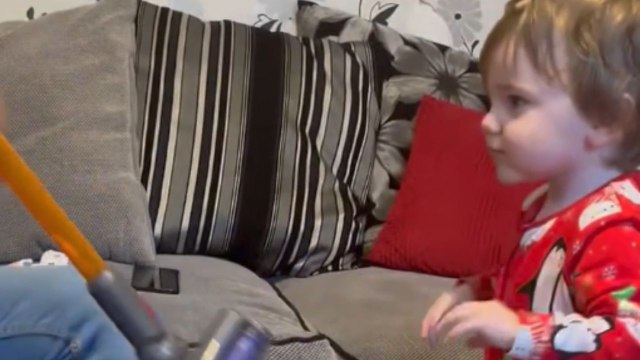 Toddler bubbles with glee after being surprised with a mini Dyson Hoover