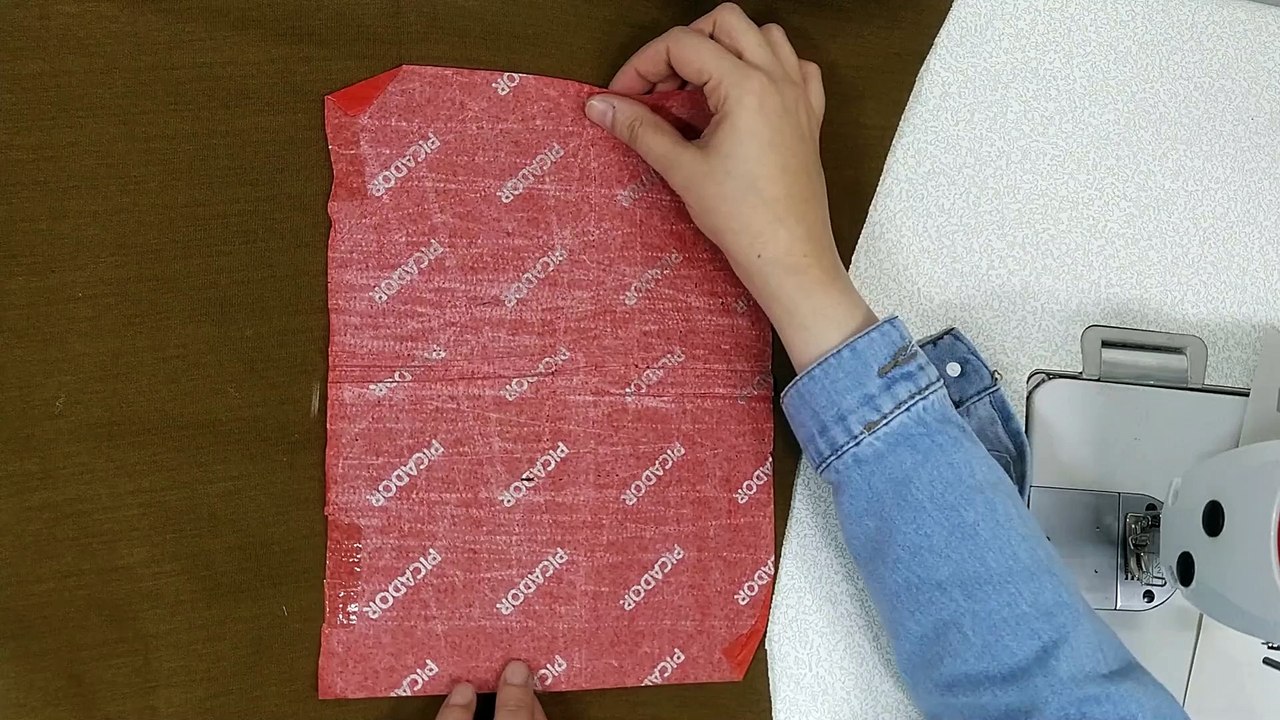 Designing and sewing a raised painting on the shirt