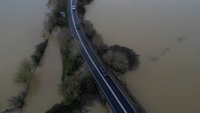 Cold weather alert issued as flooding continues to hit homes across UK