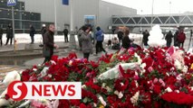 Mourners pay tribute to Russia mass shooting victims for a second day