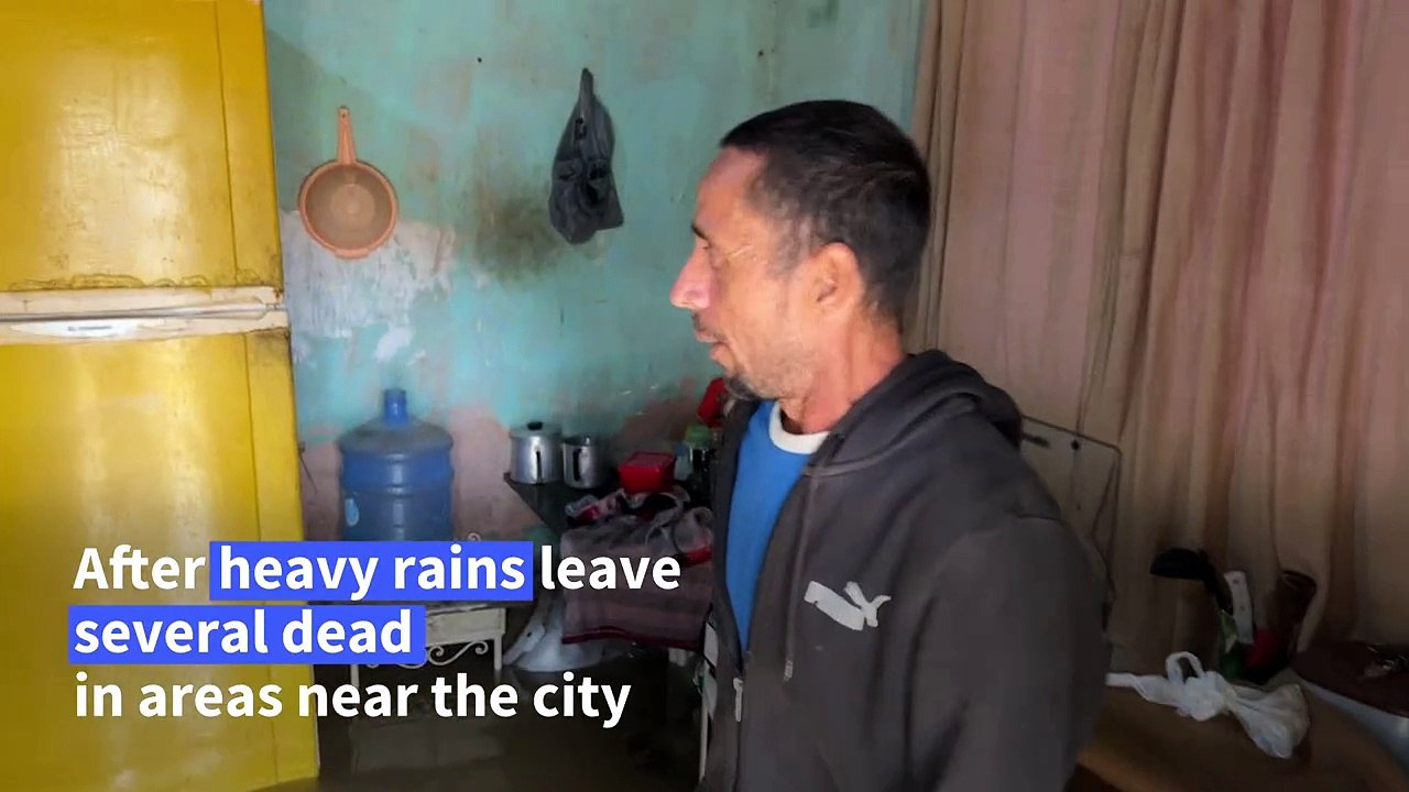 Residents of Rio suburb wait for flooding to subside before clean-up