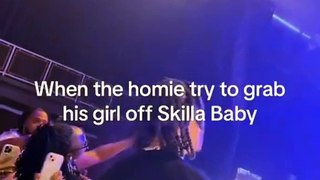 Skilla Baby accidentally takes a man's girlfriend, when he called her on stage, and she danced on him