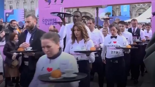 Paris waiters don traditional aprons and shirts to battle it out in revived croissant race