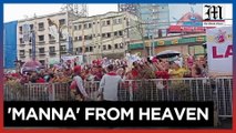 Nazarene devotees await blessing after mass