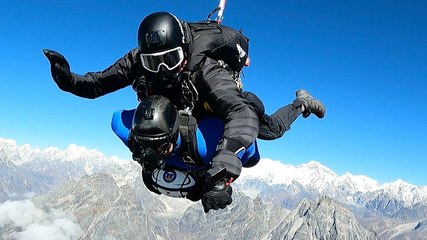 Former rugby player completes 24,000ft skydive while clutching ball