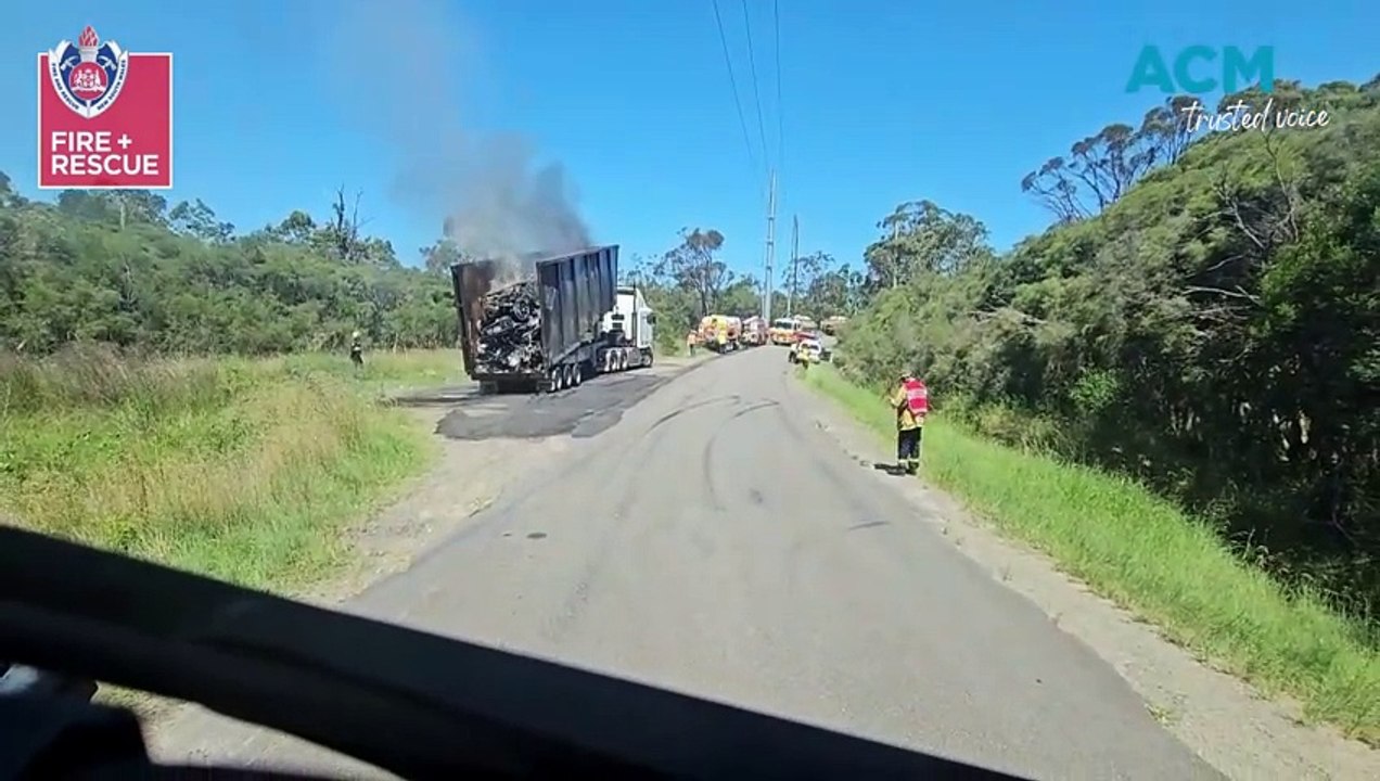 WATCH: Firefighters extinguish crushed cars near Morisset