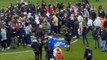 Reading fans storm pitch in protest against owner
