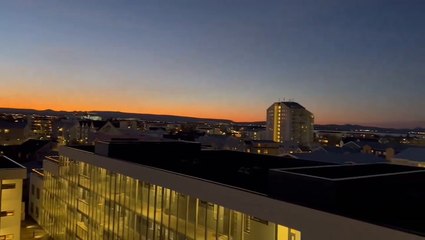 Sky glows orange across Iceland’s Reykjavik as volcano erupts in distance