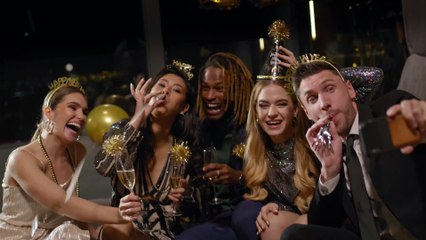 a group of cheerful friends with champagne glasses and happy