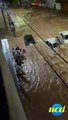 Membros da Máfia Azul fazem corrente humana para salvar ilhados durante chuva, em BH