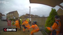 Amusing doorbell footage shows workmen winning tug of war - with manhole