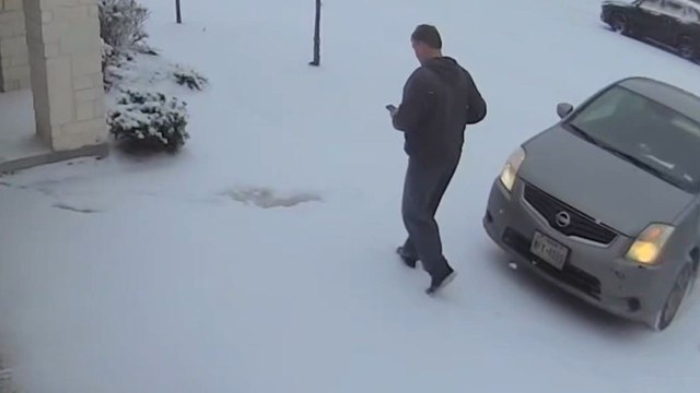 Icy ground snatches delivery driver's ability to walk without falling down