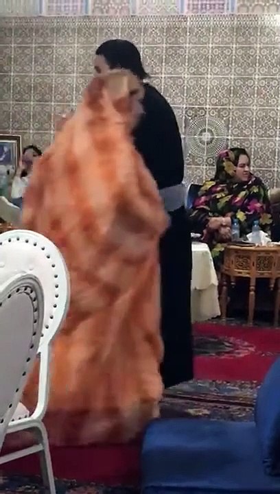 a moroccan man dancing a women s  dance