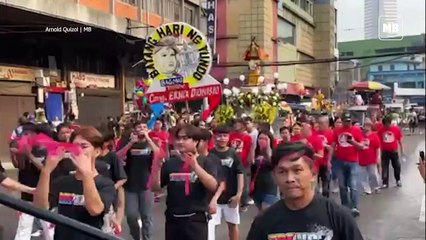 Devotees dance and raise their Santo Niño images during 'Lakbayaw'