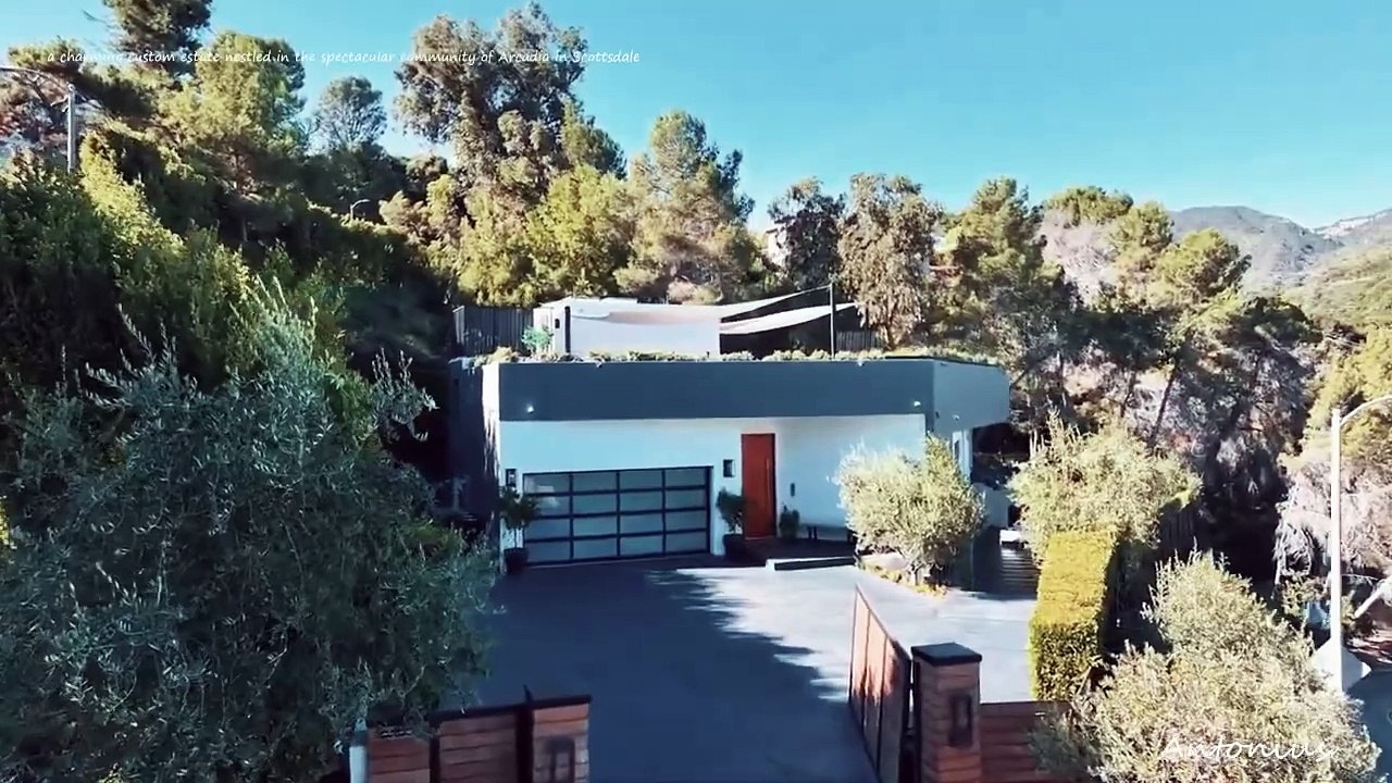 A charming custom estate nestled in the spectacular community of Arcadia in Scottsdale