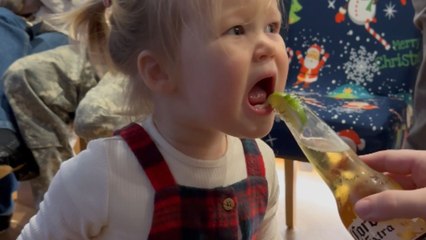 Toddler makes a comical face after trying sour lime slice *Hilarious*
