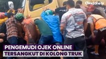 Pengemudi Ojek Online Tersangkut di Kolong Truk Setelah Tabrak Gerobak Pedagang